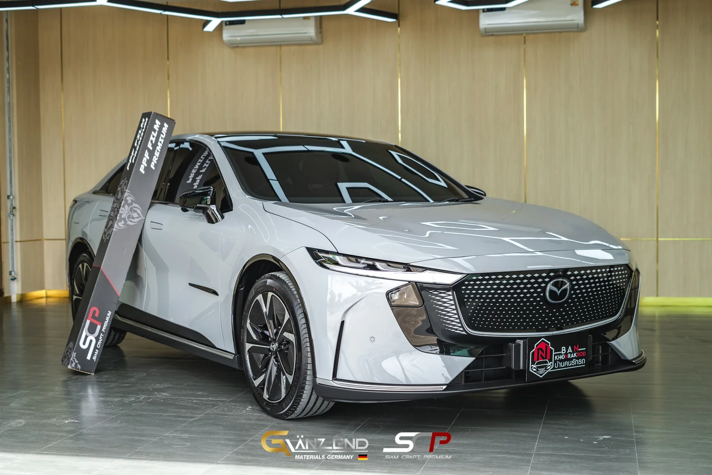 รถ Mazda 6E สีเทา ติดฟิล์มกันรอย SCP Premium GT215 เสร็จสมบูรณ์ จอดในโชว์รูม